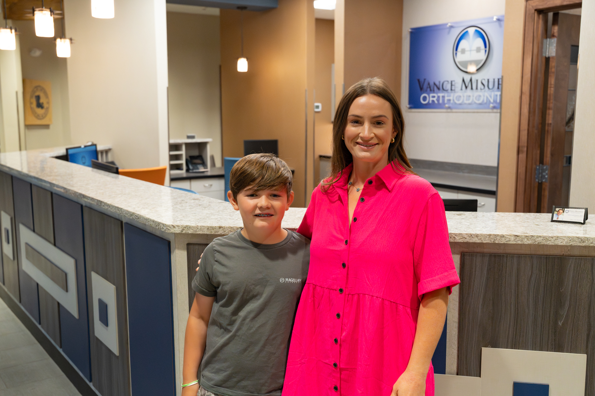 patient with braces and mom smiling
